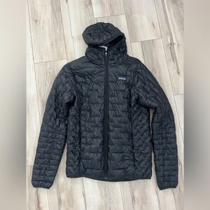 Woman’s black Patagonia nano puff hoody